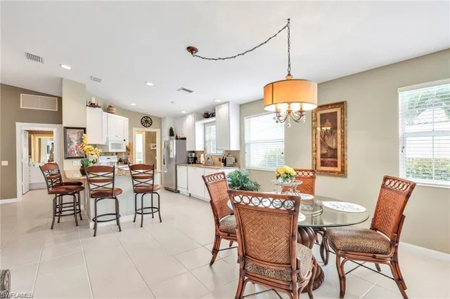a dining room with furniture and window