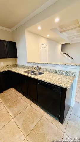 a bathroom with a toilet and a rug