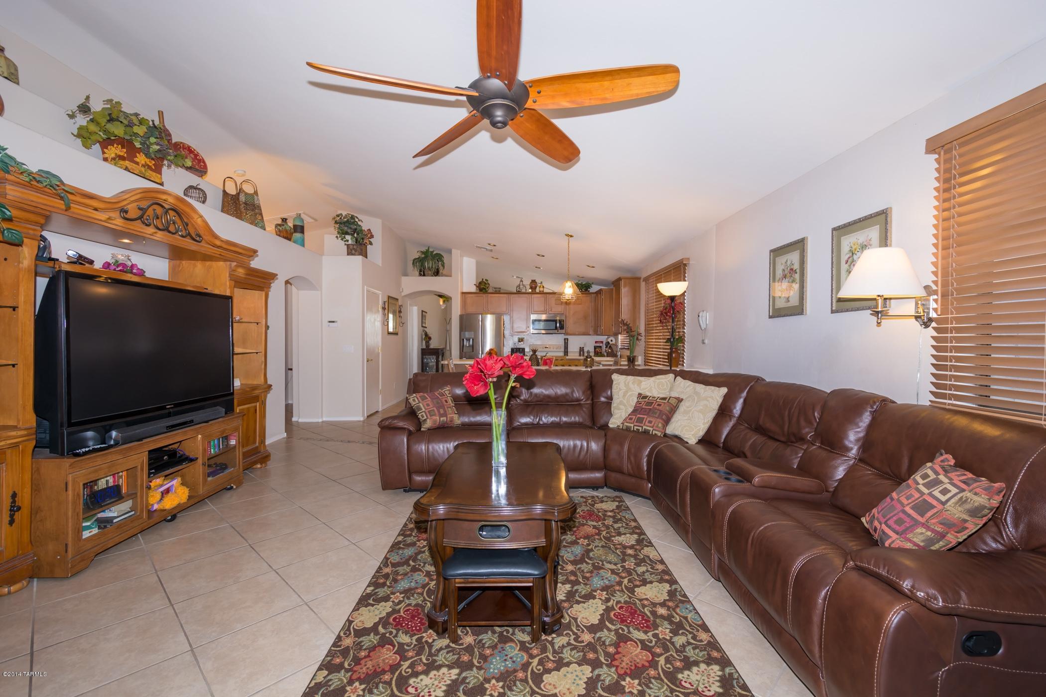 4648 South Valley Road Tucson, AZ 85714 - Photo 12 of 30 a living room with furniture and a flat screen tv