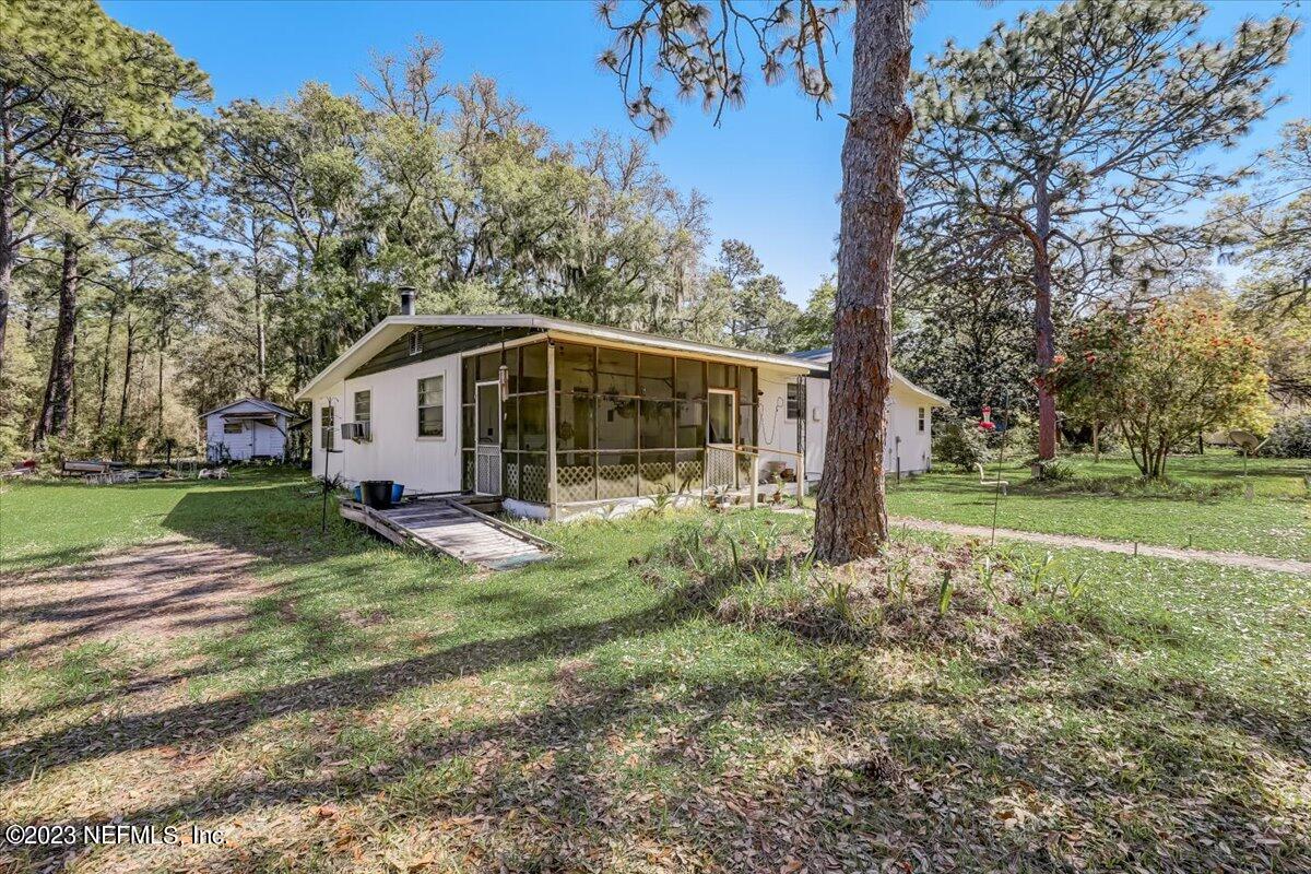 86290 Weldon Road Yulee, FL 32097 - Photo 1 of 46 a view of a house with backyard
