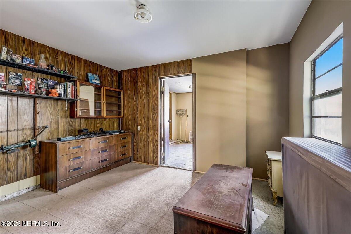 86290 Weldon Road Yulee, FL 32097 - Photo 14 of 46 a bedroom with a bed and a cabinets