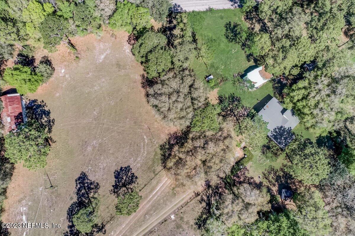86290 Weldon Road Yulee, FL 32097 - Photo 2 of 46 an aerial view of a house with a yard