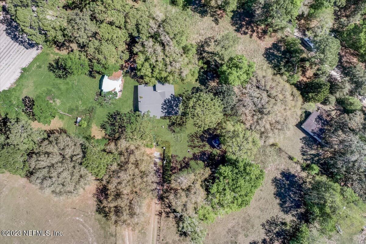 86290 Weldon Road Yulee, FL 32097 - Photo 25 of 46 an aerial view of a houses with a yard