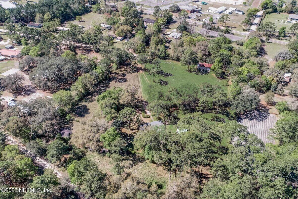 86290 Weldon Road Yulee, FL 32097 - Photo 26 of 46 a view of a forest with a tree
