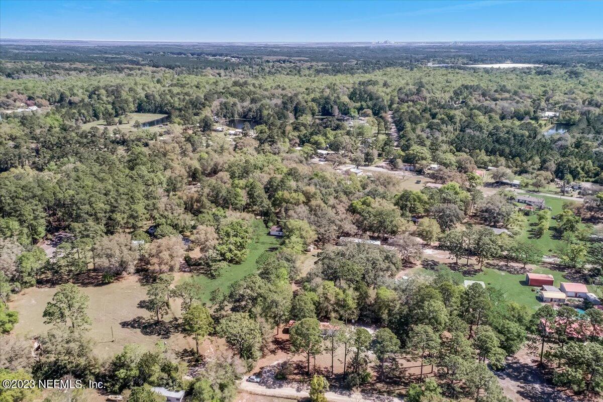 86290 Weldon Road Yulee, FL 32097 - Photo 28 of 46 a view of a city with lush green forest