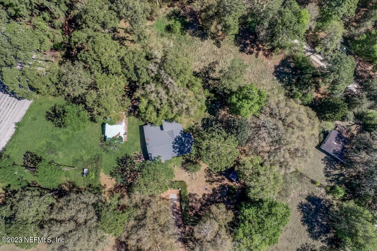 86290 Weldon Road Yulee, FL 32097 - Photo 31 of 46 an aerial view of a house with a yard