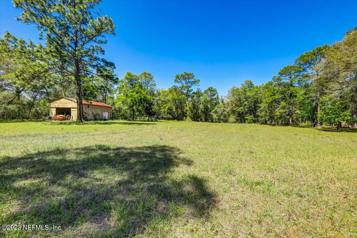 86290 Weldon Road Yulee, FL 32097 - Photo 41 of 46 a view of a field with tree in the background