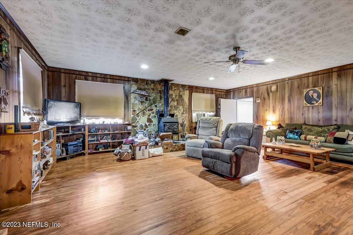 86290 Weldon Road Yulee, FL 32097 - Photo 7 of 46 a living room with furniture and wooden floor