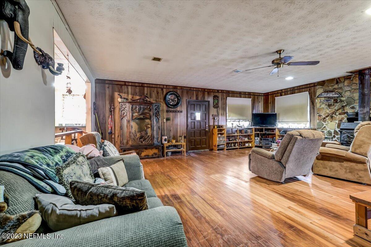 86290 Weldon Road Yulee, FL 32097 - Photo 10 of 46 a living room with furniture and a large window
