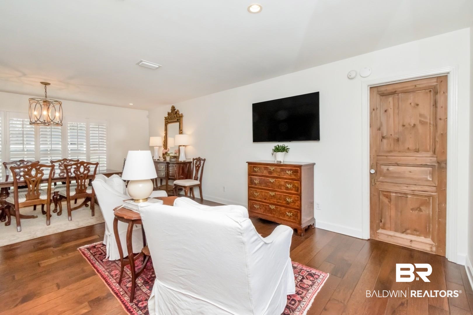 154 Fenwick Road Mobile, AL 36608 - Photo 14 of 48 Living room with dark wood-type flooring and a chandelier