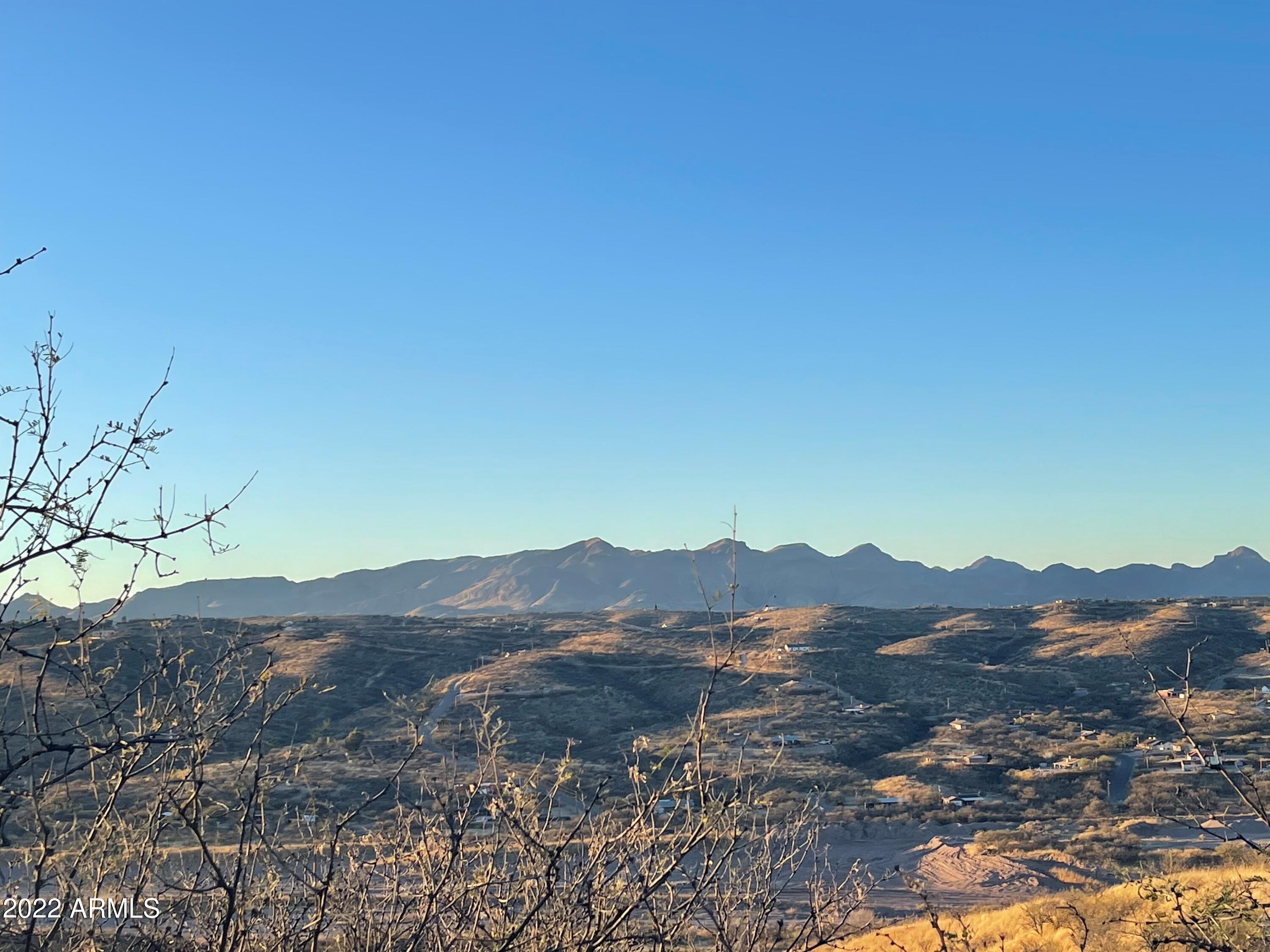 1119 Circulo Montosa, Unit 66 Rio Rico, AZ 85648 - Photo 5 of 7 a view of a lake with a mountain in the background