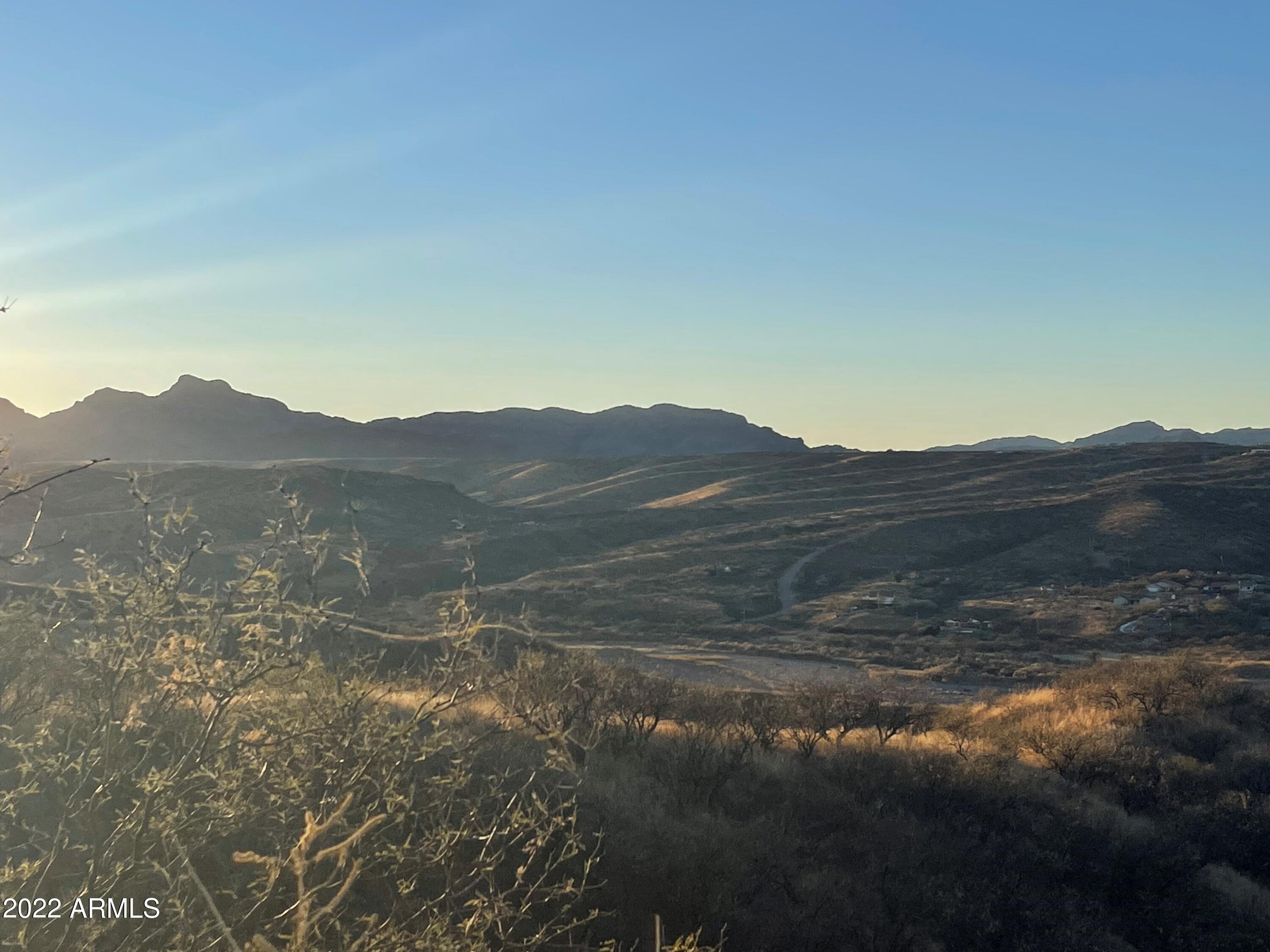 1119 Circulo Montosa, Unit 66 Rio Rico, AZ 85648 - Photo 6 of 7 a view of a mountain range with a lush green forest