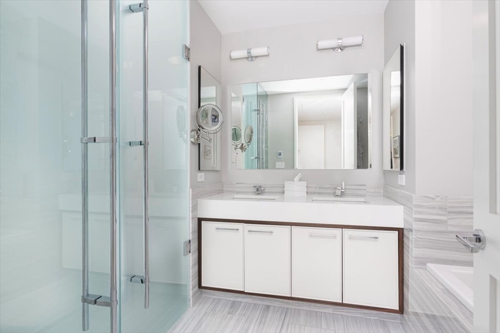 1 Dalton Street, Unit 5402 Boston, MA 02115 - Photo 13 of 17 a bathroom with a sink and a mirror