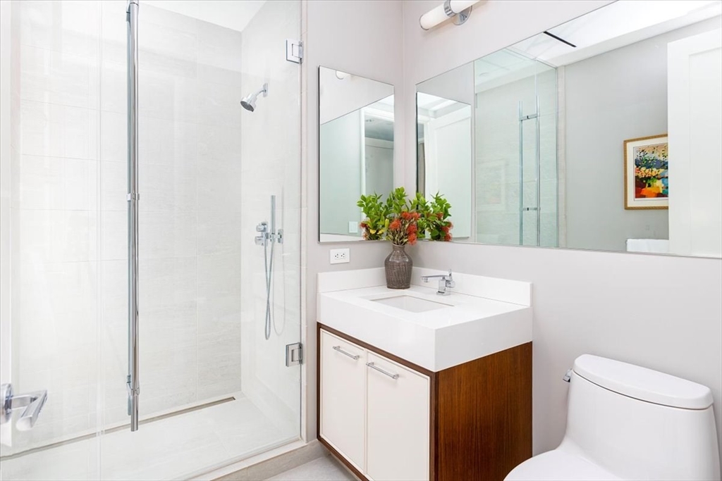 1 Dalton Street, Unit 5402 Boston, MA 02115 - Photo 15 of 17 a bathroom with a sink a toilet and shower