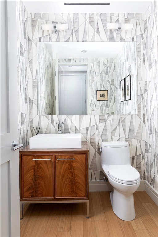 1 Dalton Street, Unit 5402 Boston, MA 02115 - Photo 16 of 17 a spacious bathroom with a granite countertop toilet and a sink