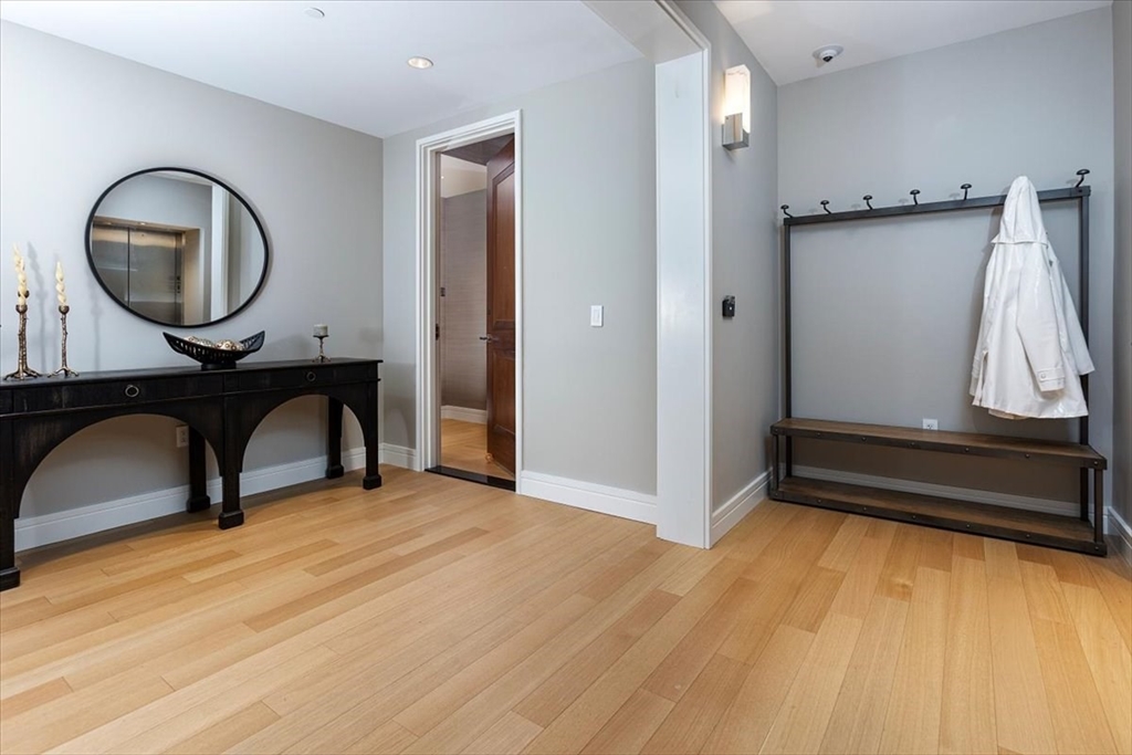 1 Dalton Street, Unit 5402 Boston, MA 02115 - Photo 17 of 17 a view of a livingroom with furniture and a mirror