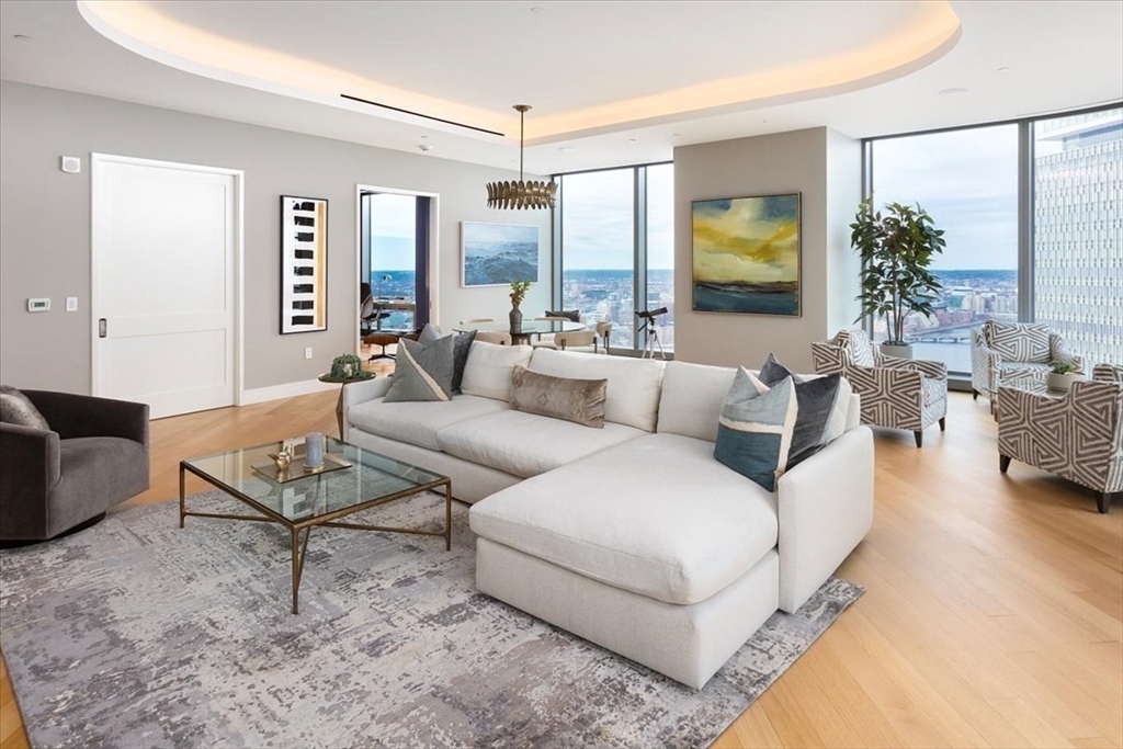 1 Dalton Street, Unit 5402 Boston, MA 02115 - Photo 2 of 17 a living room with furniture and a large window