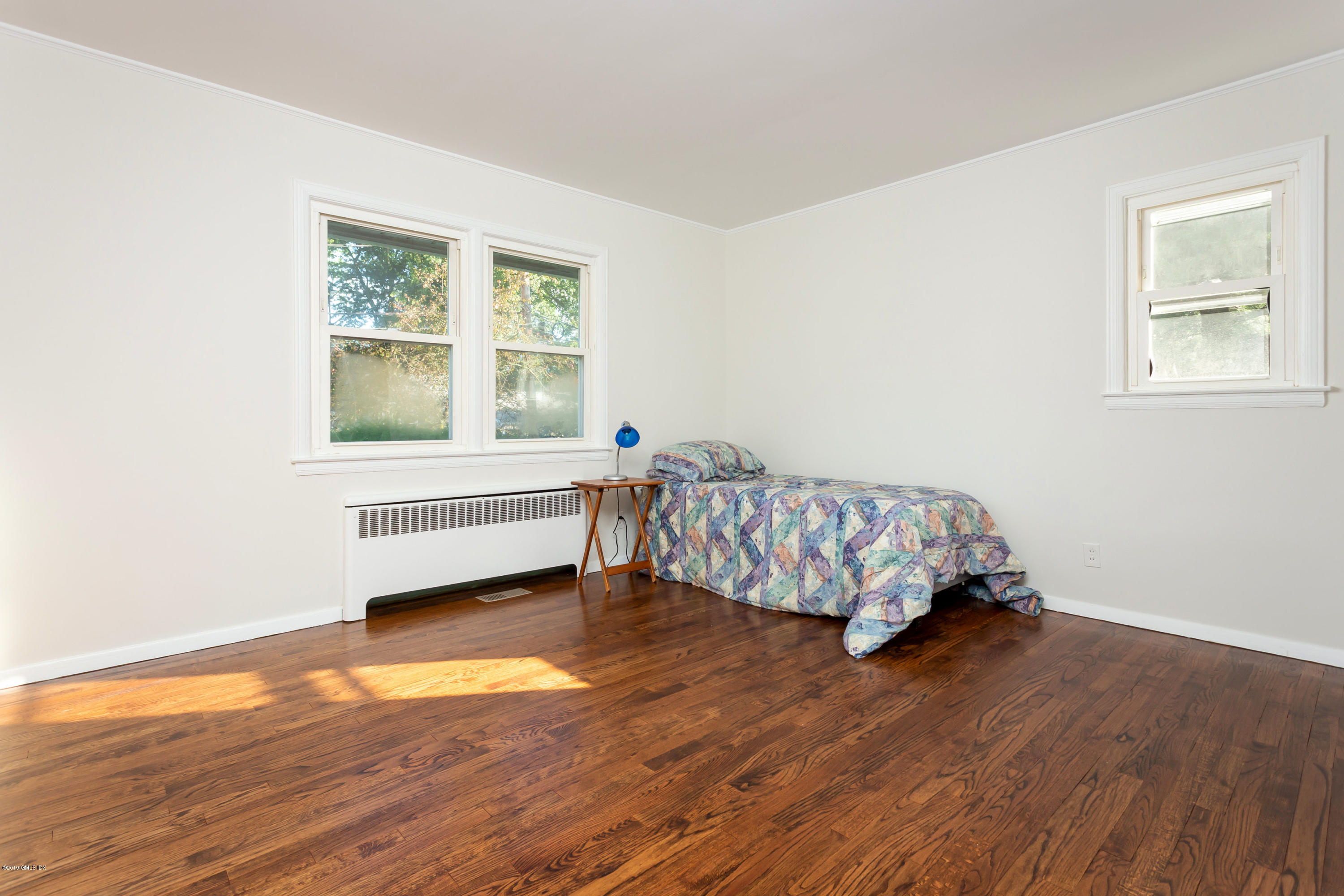20 Silver Beech Road Riverside, CT 06878 - Photo 13 of 33 a room with wooden floor and a window
