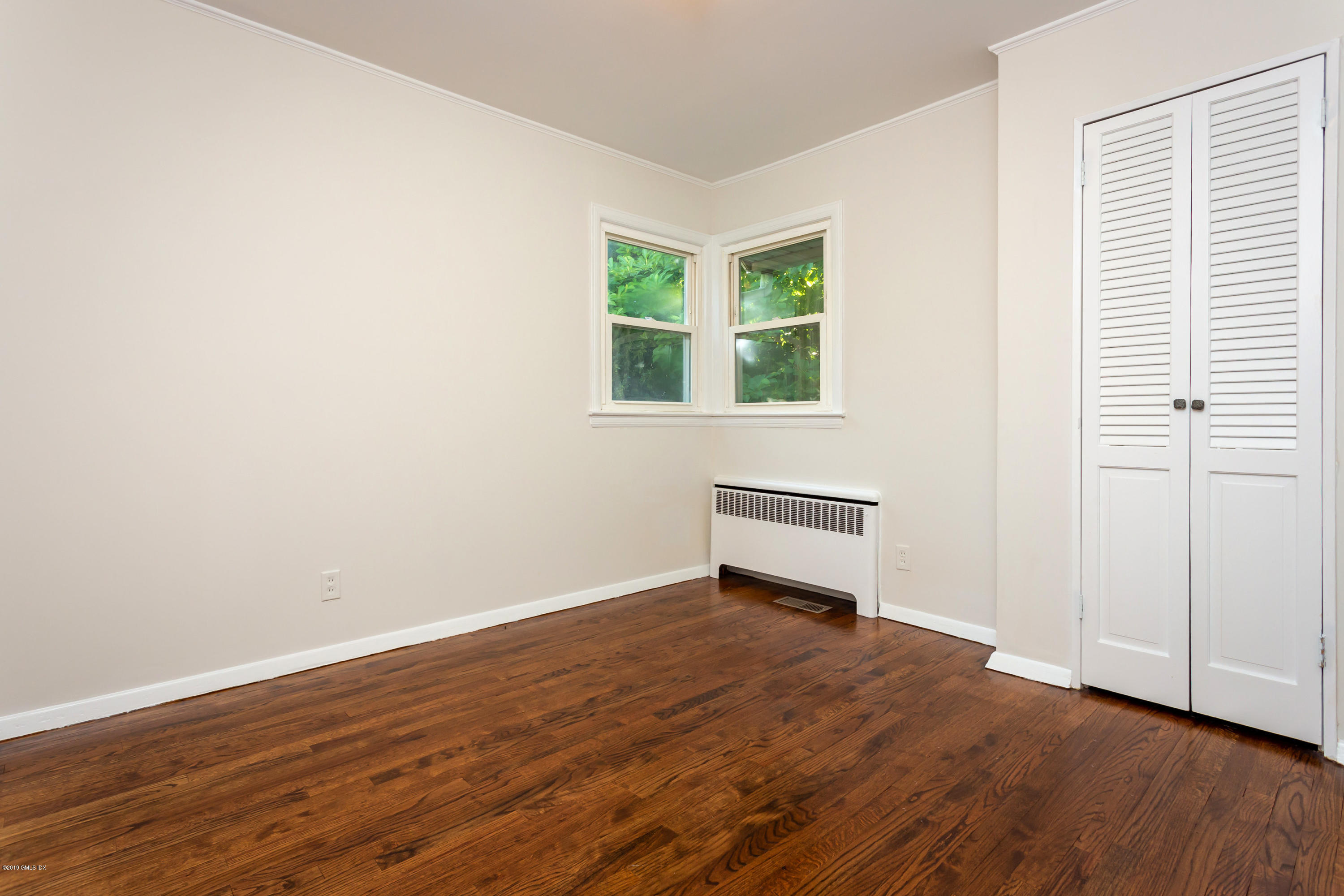 20 Silver Beech Road Riverside, CT 06878 - Photo 14 of 33 an empty room with wooden floor and windows