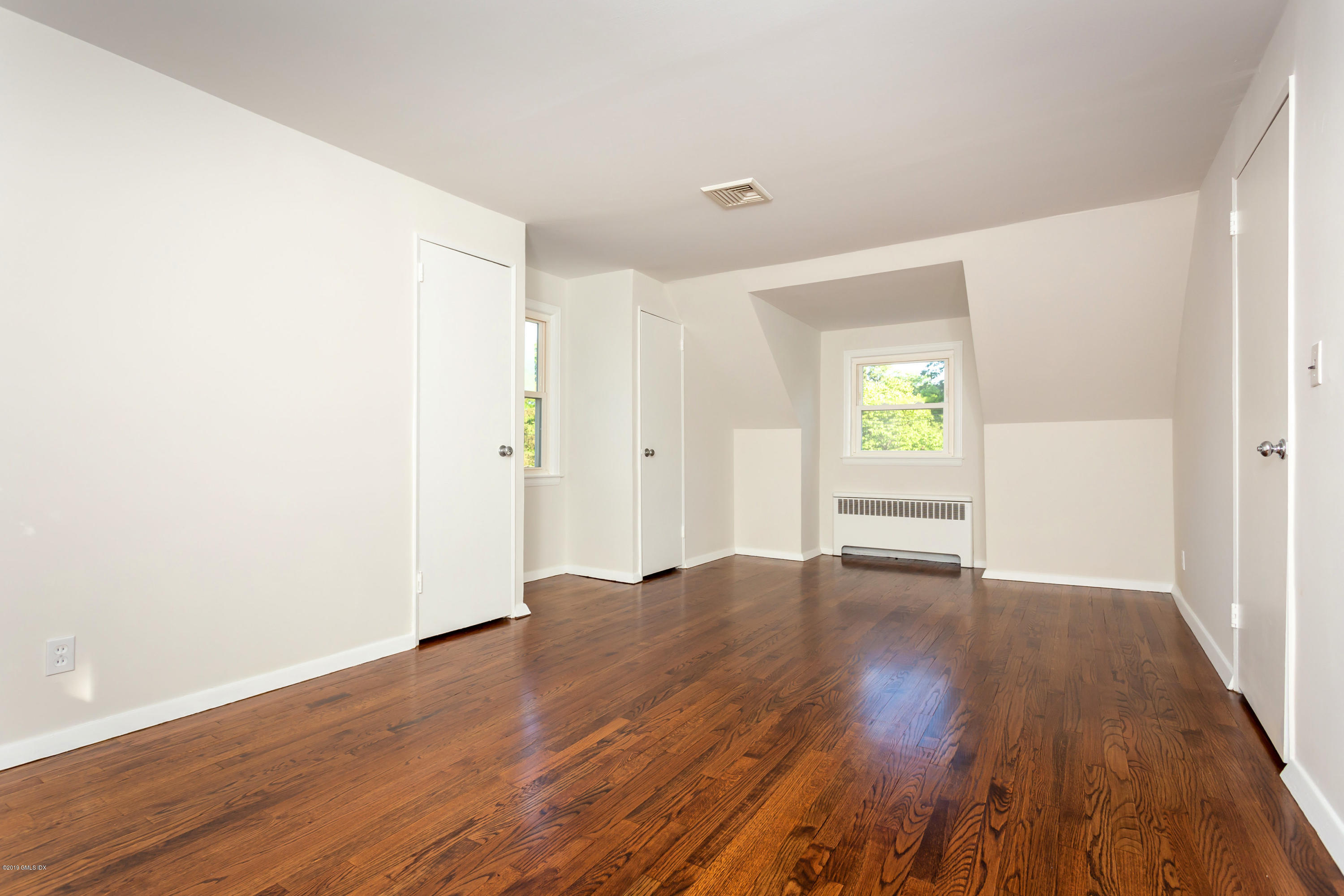 20 Silver Beech Road Riverside, CT 06878 - Photo 16 of 33 an empty room with wooden floor and windows