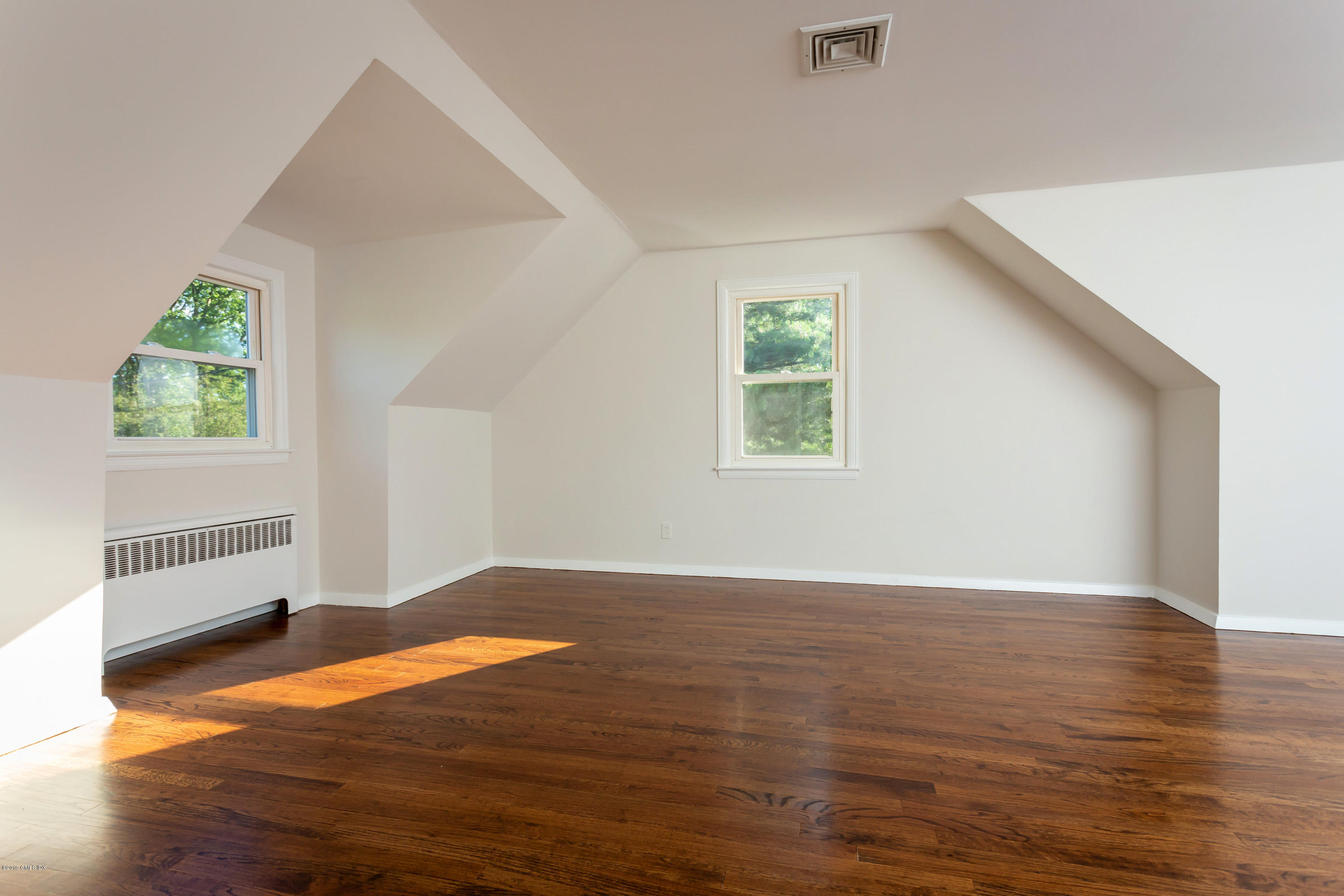 20 Silver Beech Road Riverside, CT 06878 - Photo 17 of 33 an empty room with wooden floor and windows