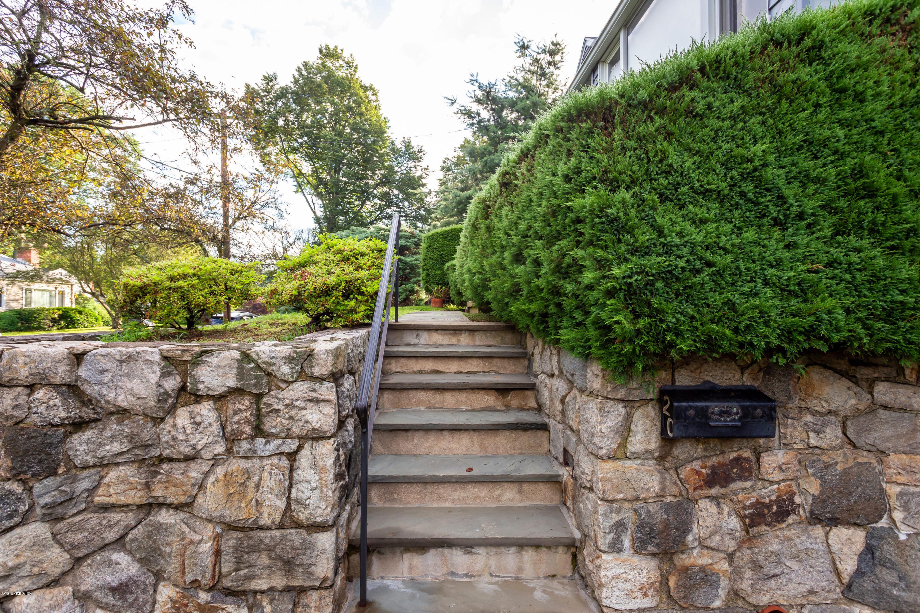 20 Silver Beech Road Riverside, CT 06878 - Photo 20 of 33 a view of a yard with plants and a fountain