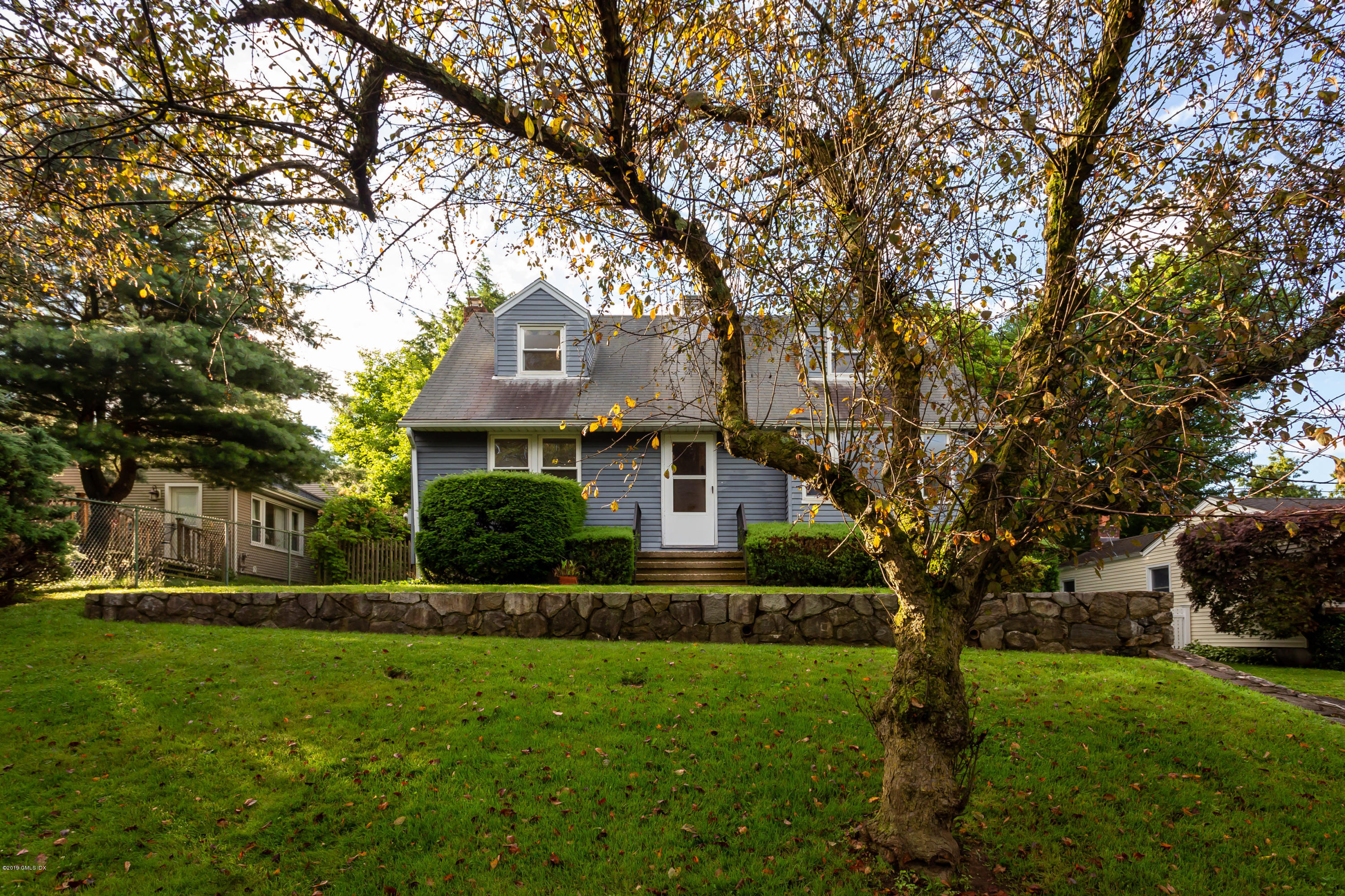 20 Silver Beech Road Riverside, CT 06878 - Photo 2 of 33 a front view of a house with a yard