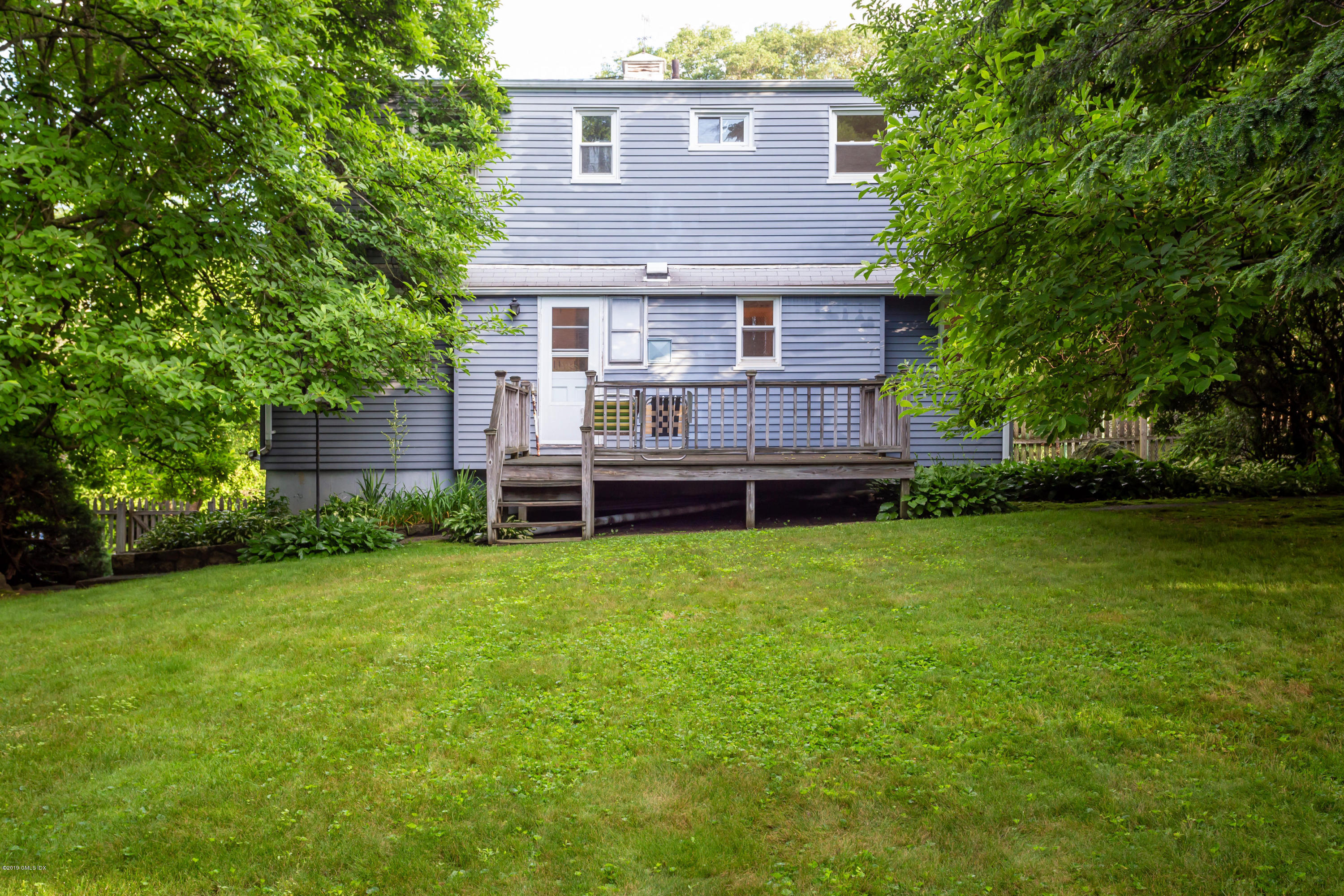 20 Silver Beech Road Riverside, CT 06878 - Photo 24 of 33 a front view of a house with a garden