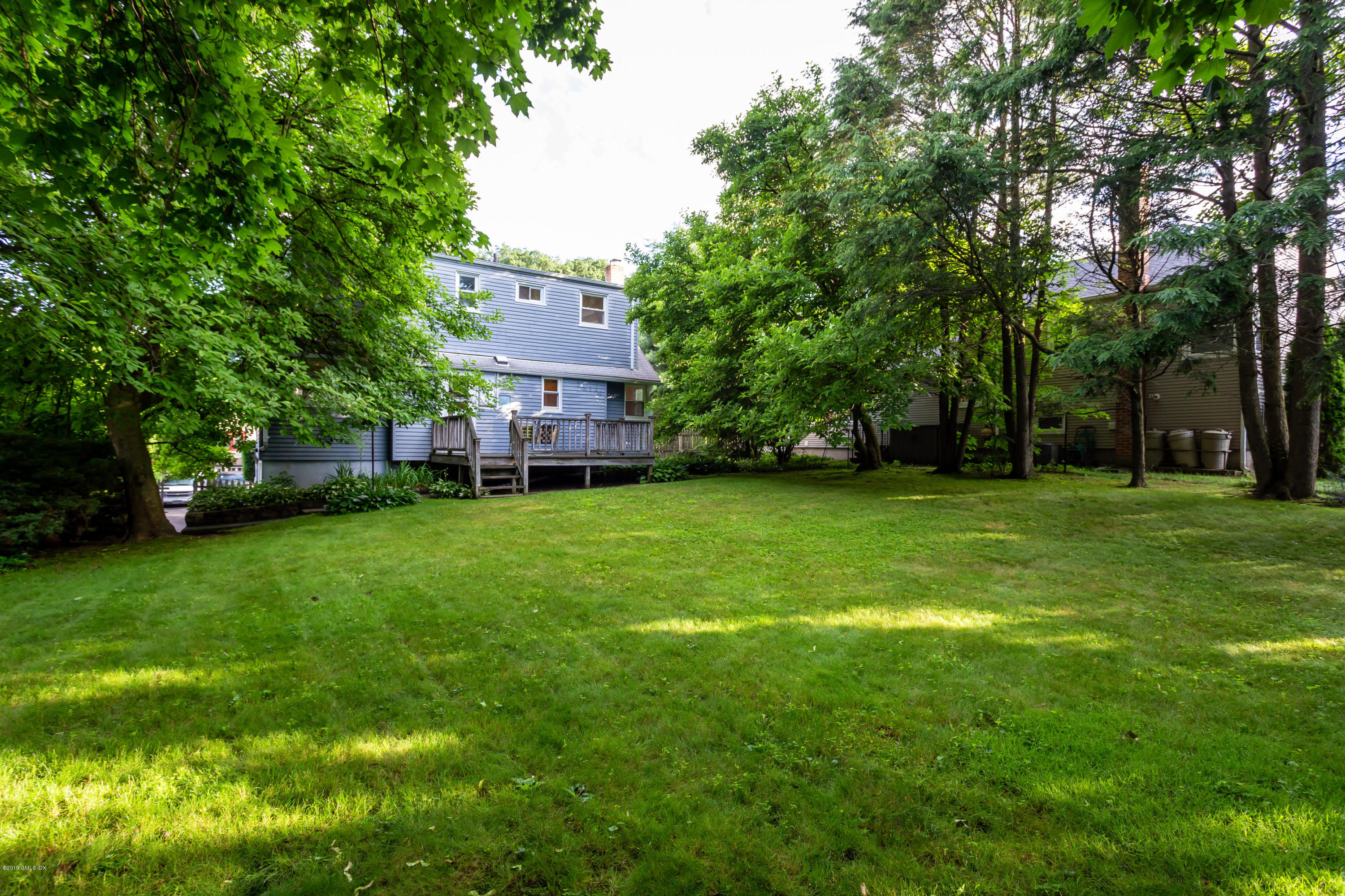 20 Silver Beech Road Riverside, CT 06878 - Photo 25 of 33 a view of a house with a big yard
