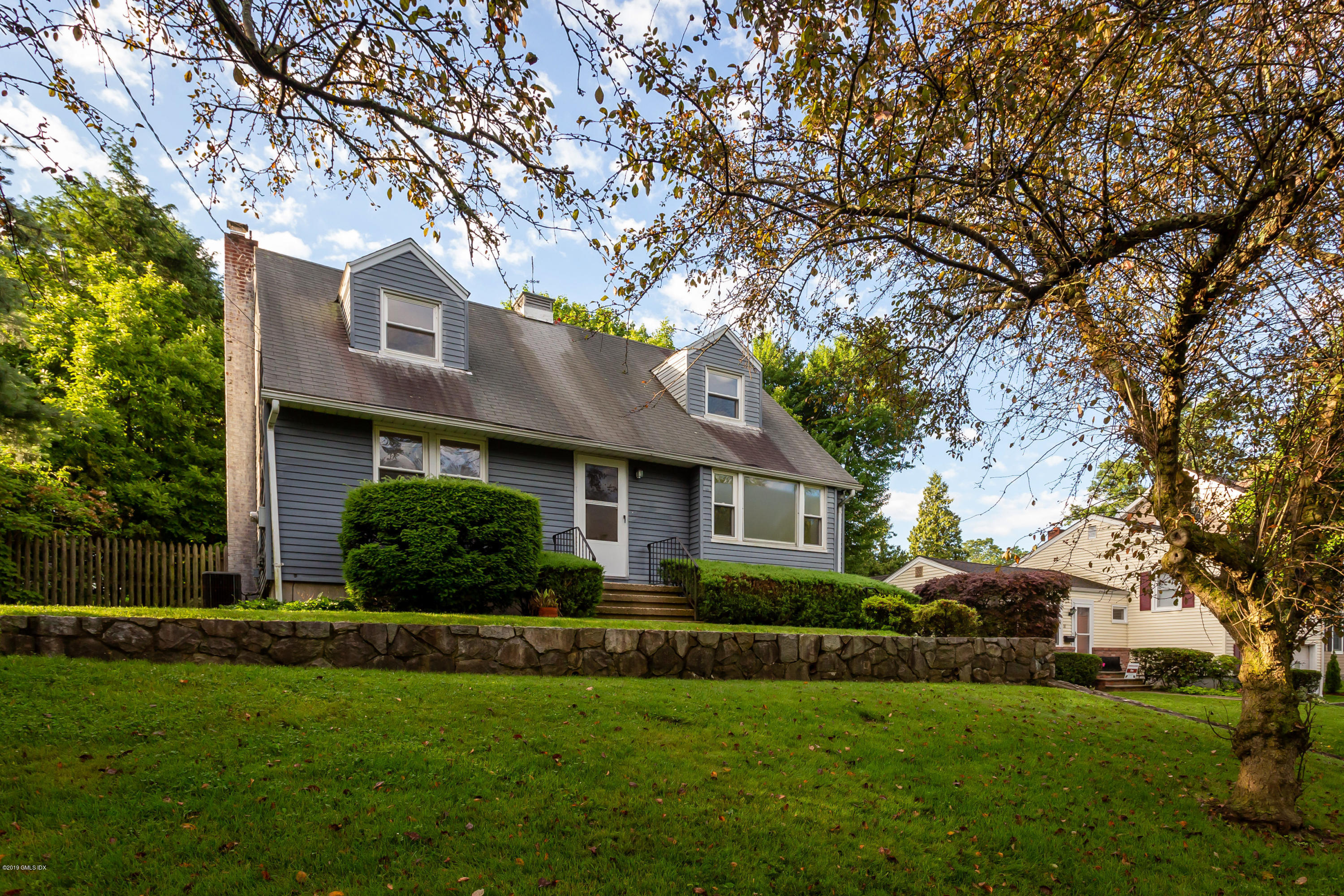 20 Silver Beech Road Riverside, CT 06878 - Photo 3 of 33 a front view of house with yard and green space