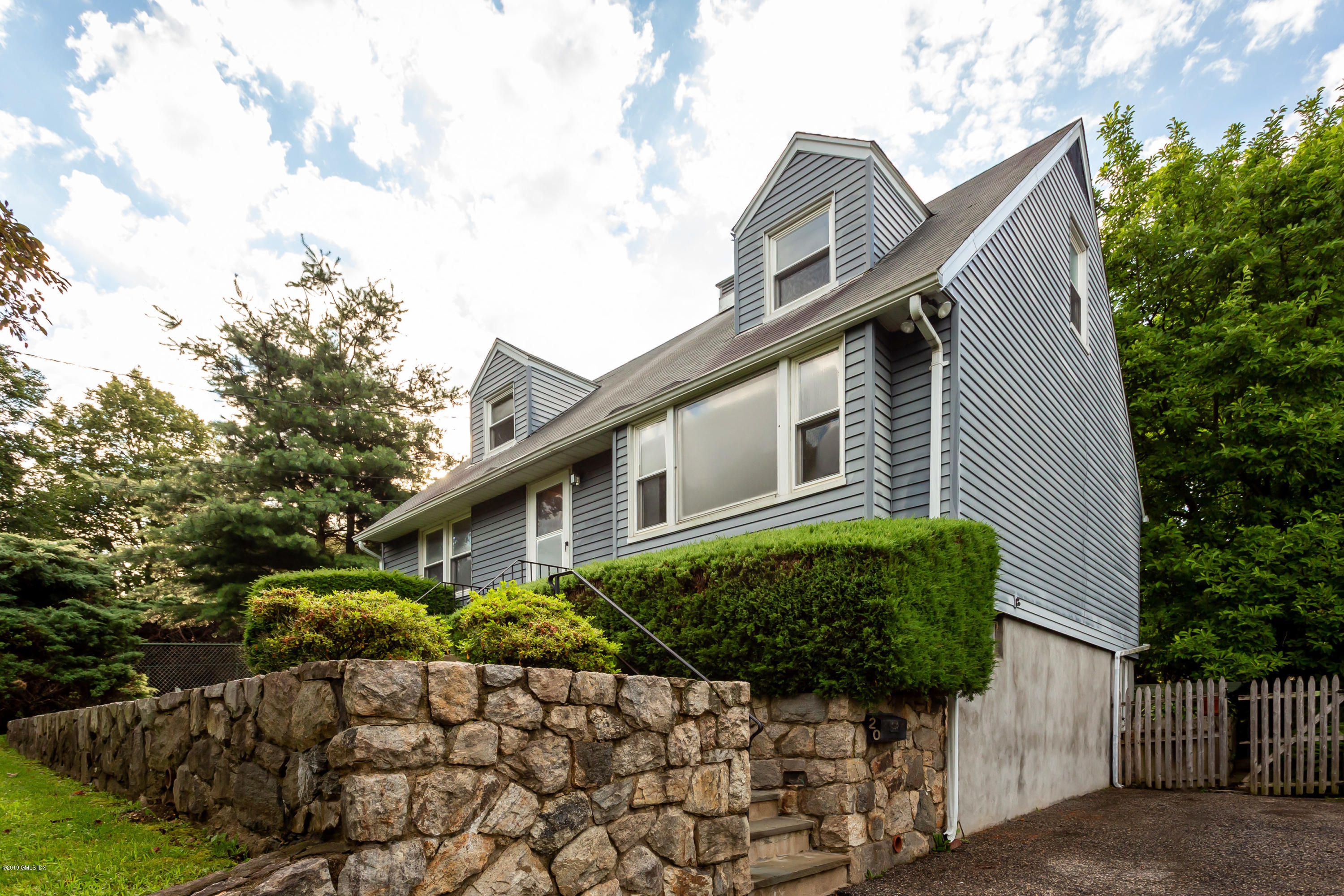 20 Silver Beech Road Riverside, CT 06878 - Photo 6 of 33 a front view of a house with a yard