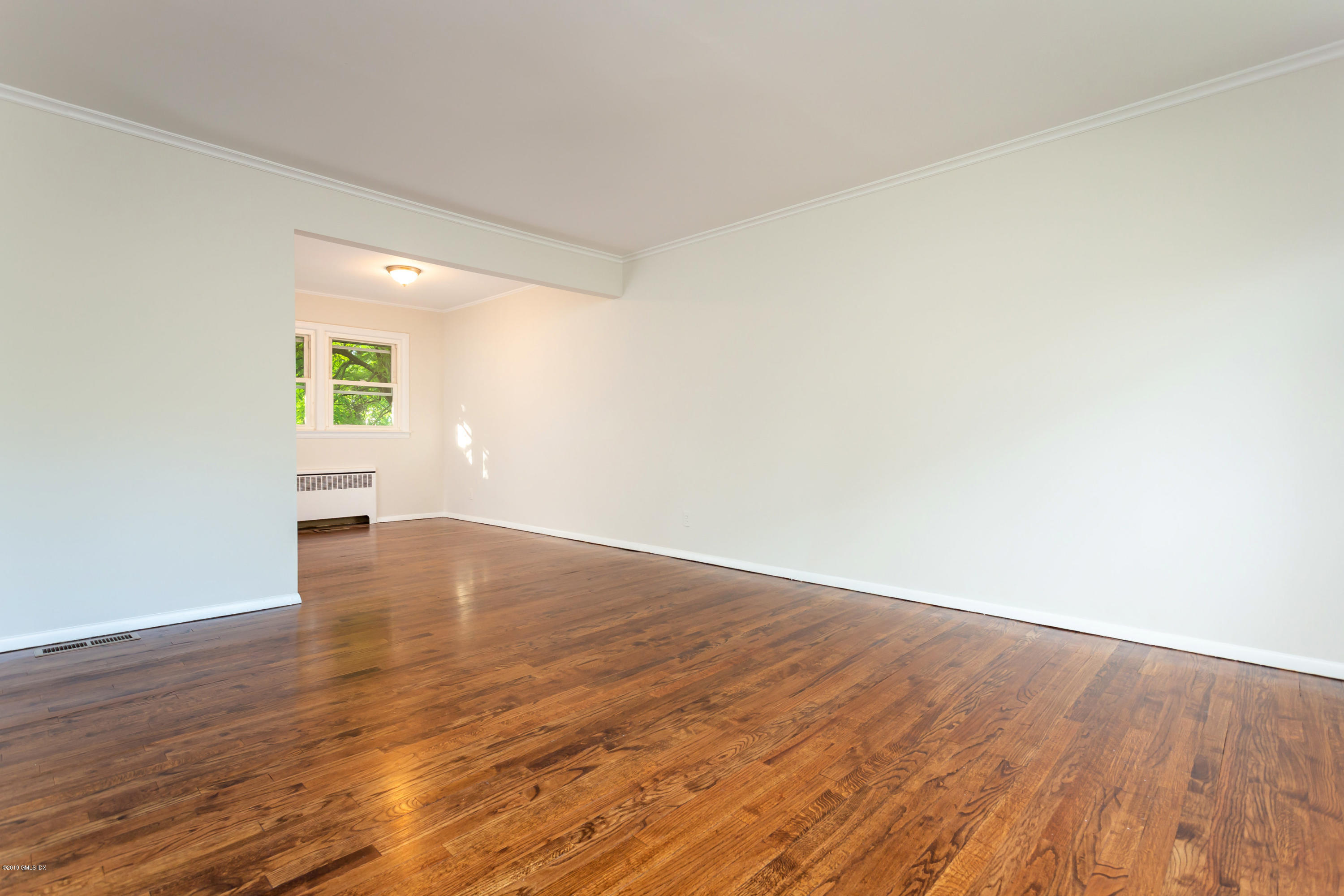 20 Silver Beech Road Riverside, CT 06878 - Photo 7 of 33 an empty room with wooden floor and windows