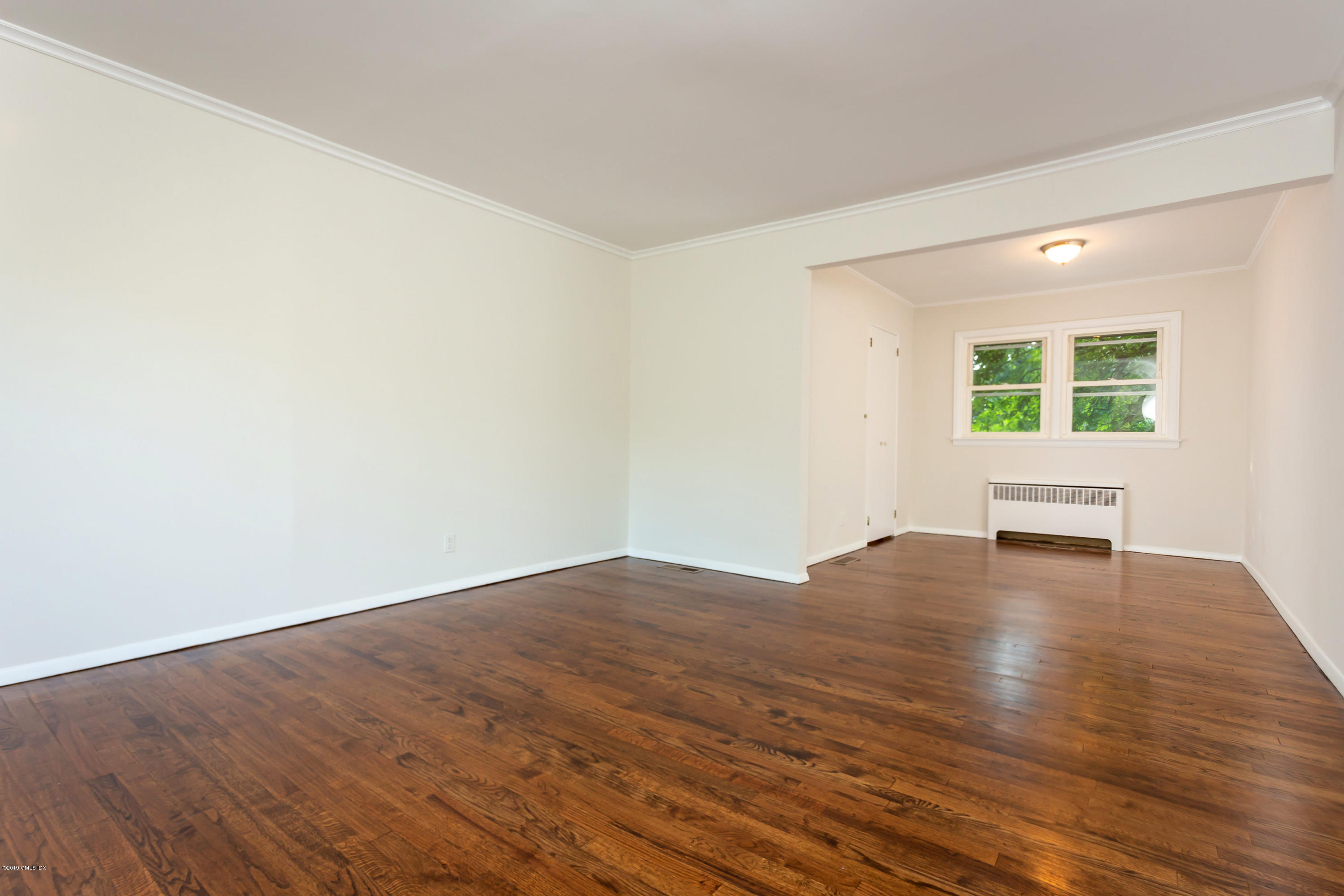 20 Silver Beech Road Riverside, CT 06878 - Photo 9 of 33 an empty room with wooden floor and windows