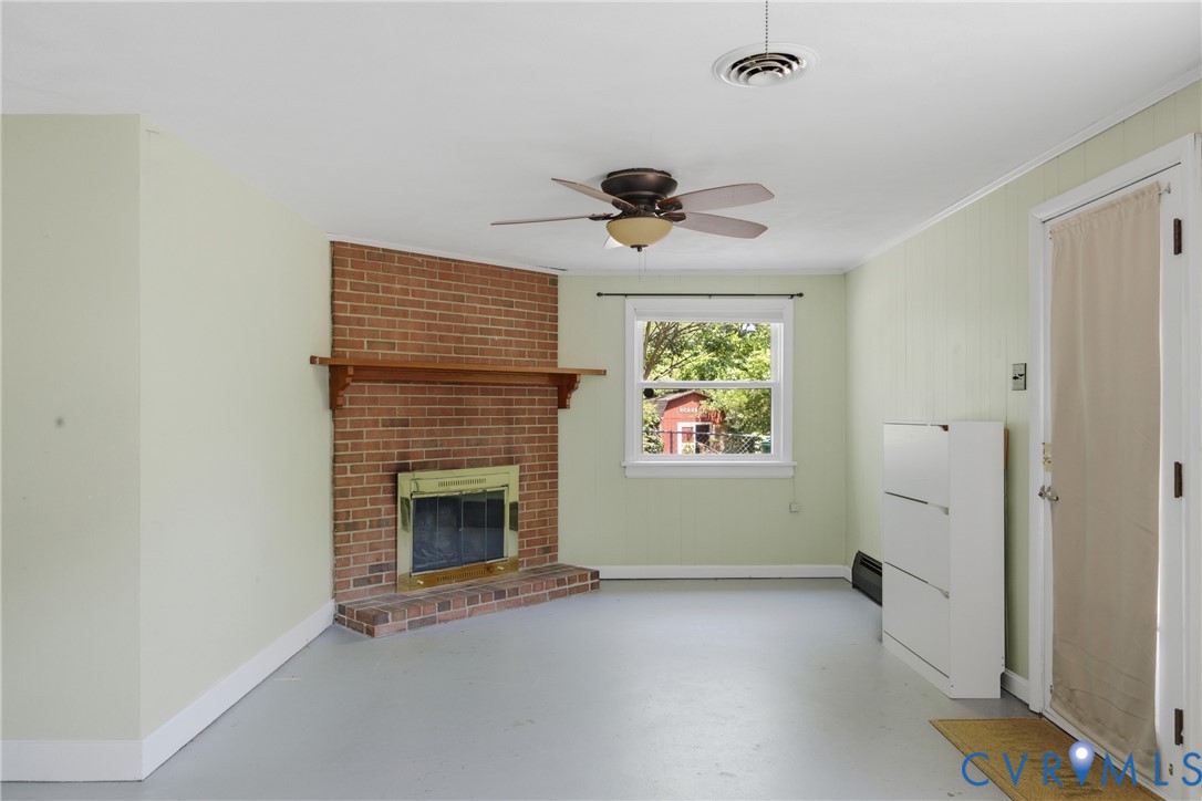 8210 Ireton Road Henrico, VA 23228 - Photo 12 of 36 a view of an empty room with a window and fireplace