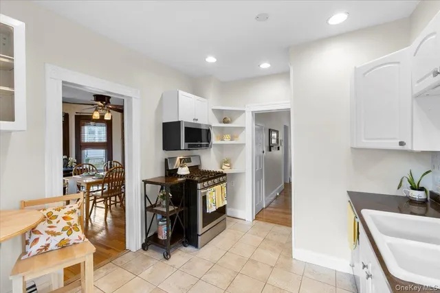 a kitchen with stainless steel appliances granite countertop a sink and cabinets