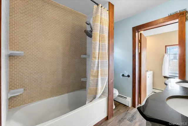 a bathroom with a sink a mirror and a shower