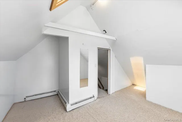 a view of an empty room and hallway