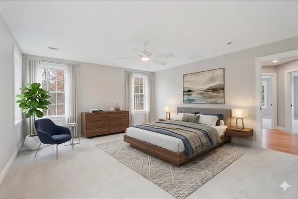 a spacious bedroom with a bed and a couch