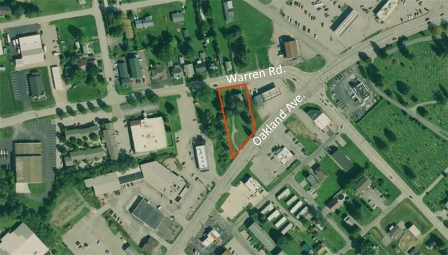 an aerial view of multi story residential apartment building with entryway