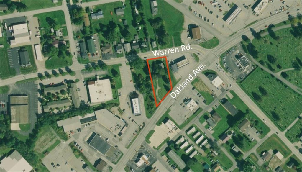 an aerial view of multi story residential apartment building with entryway