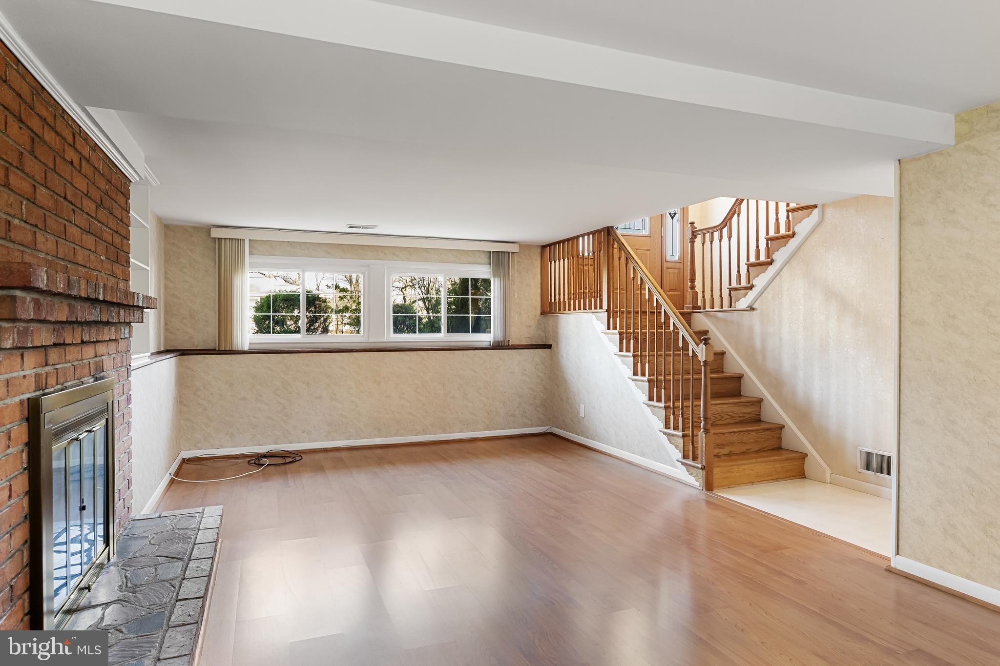 16 Hunter Drive Delran, NJ 08075 - Photo 21 of 29 a view of an empty room with wooden floor and a window