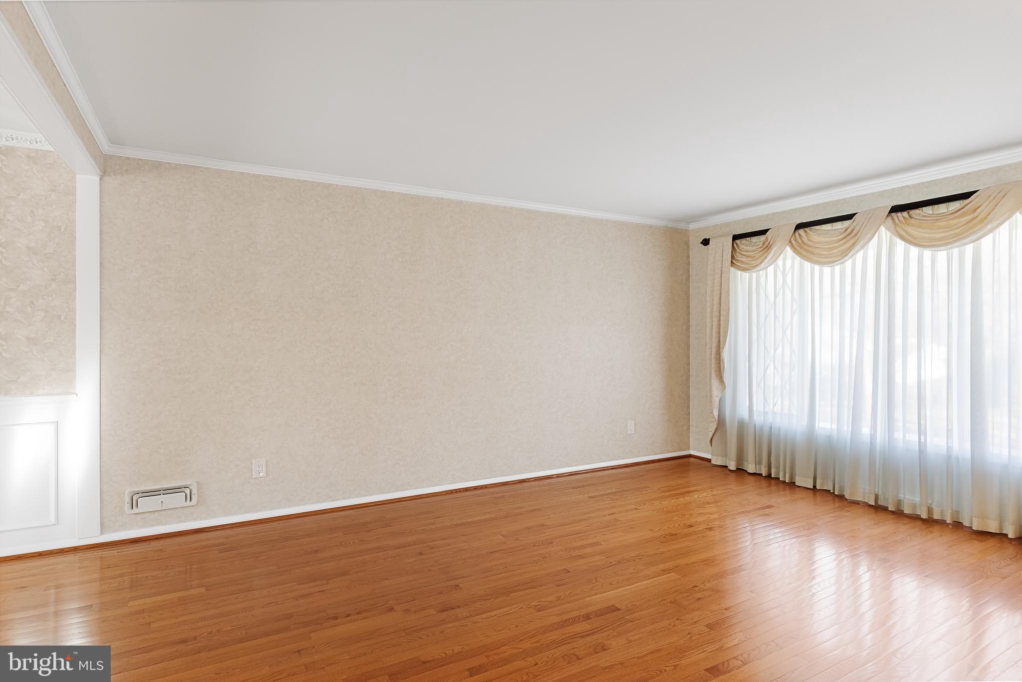 16 Hunter Drive Delran, NJ 08075 - Photo 6 of 29 a view of an empty room with wooden floor and a window