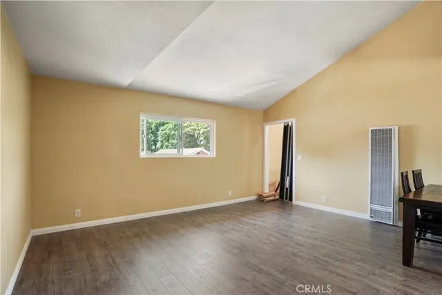 a view of room with window and hardwood floor