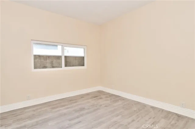 a street view with couple of cars parked on road