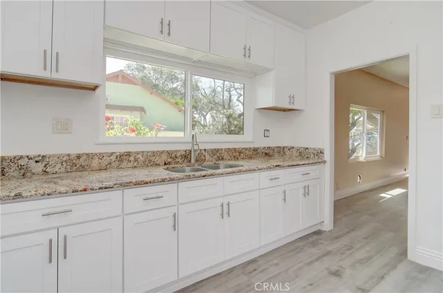 a view of a house with outdoor space and sitting area