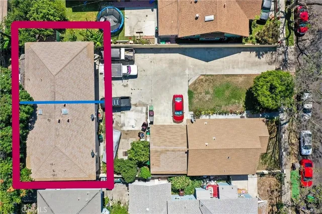 an aerial view of house and yard