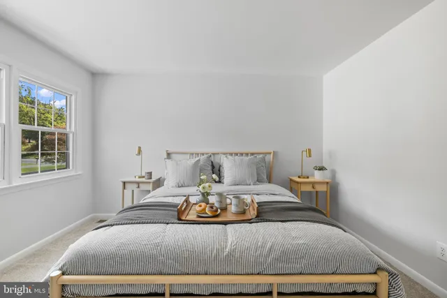 a bedroom with a bed and window