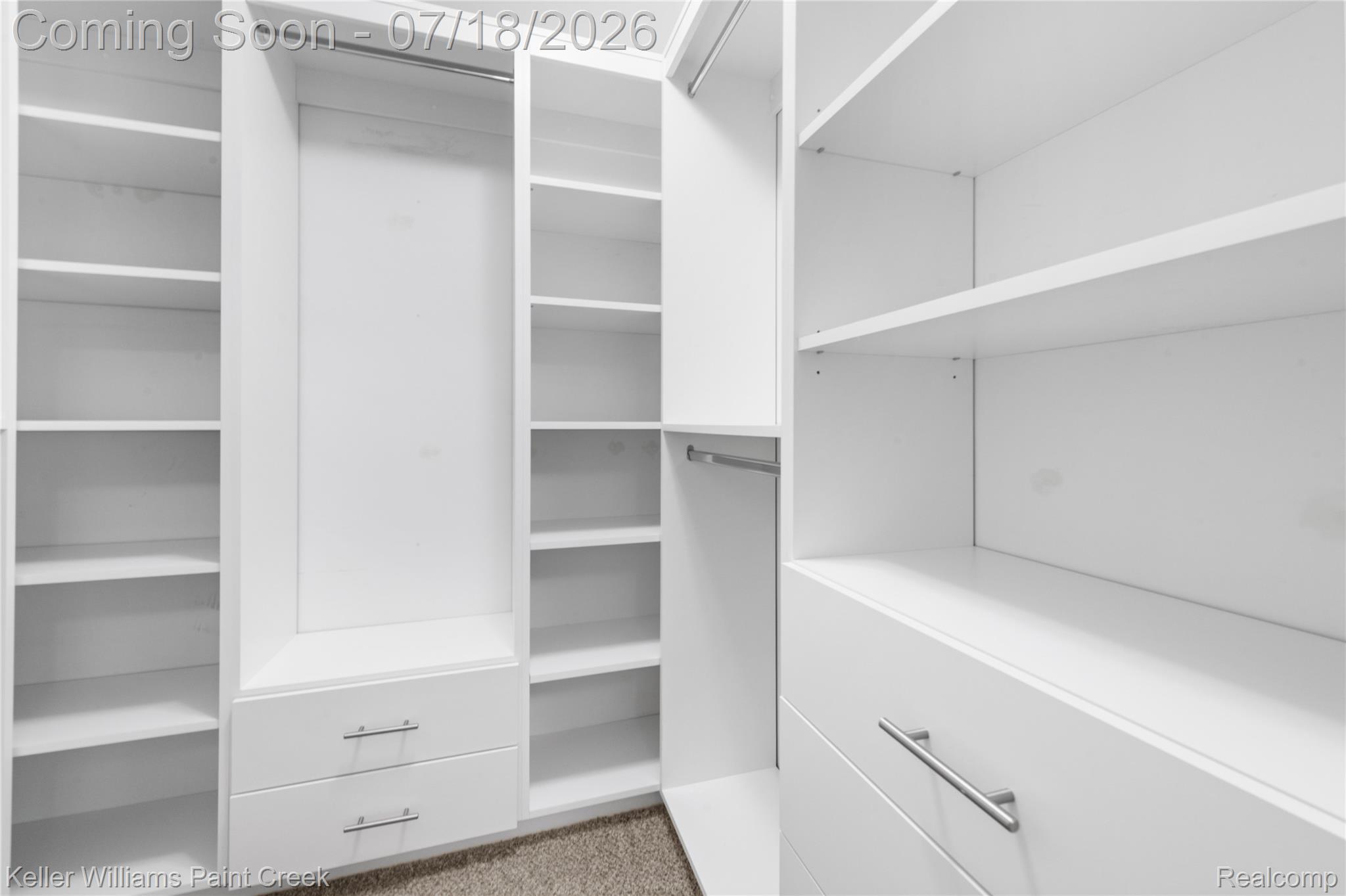 4230 Holly Lane Rochester, MI 48306 - Photo 30 of 64 Custom white closet system featuring multiple shelving units and integrated drawers