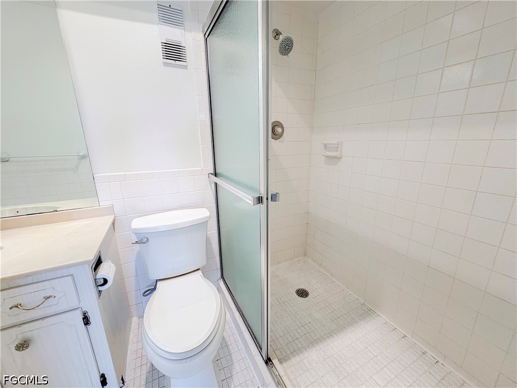 1830 Brantley Road, Unit I7 Fort Myers, FL 33907 - Photo 17 of 34 a bathroom with a toilet and a shower