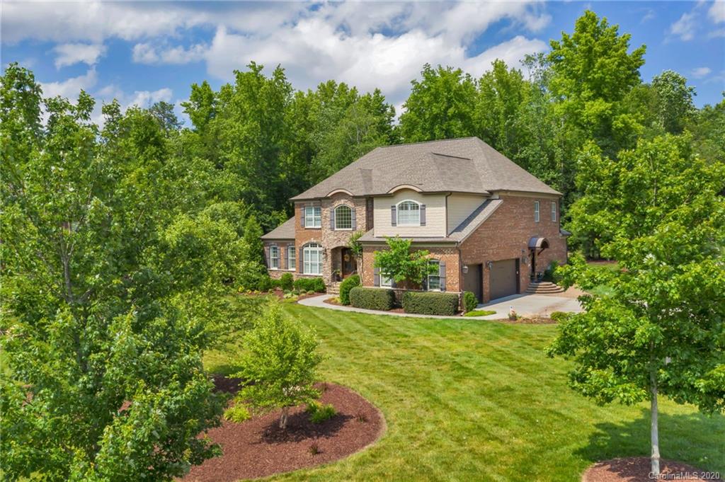 1401 Delaney Drive Weddington, NC 28104 - Photo 2 of 48 a view of a house with a yard and potted plants